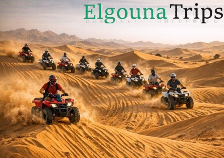 Tourists driving quad bikes during a Mega Desert Safari in the Egyptian desert.