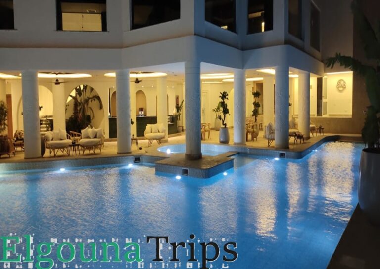 A beautifully illuminated luxury pool and outdoor lounge area at a premium wellness center offering the best Luxury Spa Experience in El Gouna.
