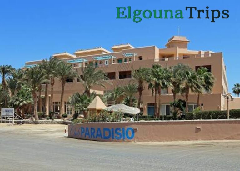 Exterior view of Club Paradisio El Gouna: Ultimate Red Sea Resort Guide showing lush palm trees and beachfront architecture.