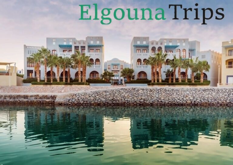 Fanadir Hotel El Gouna viewed across the peaceful lagoon waters at sunset.
