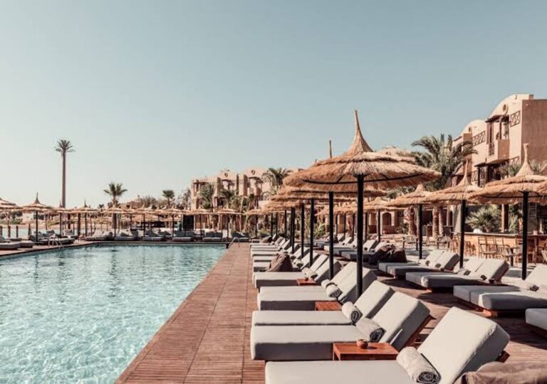 Spa & Trips from Cook's Club El Gouna relaxing pool and loungers
