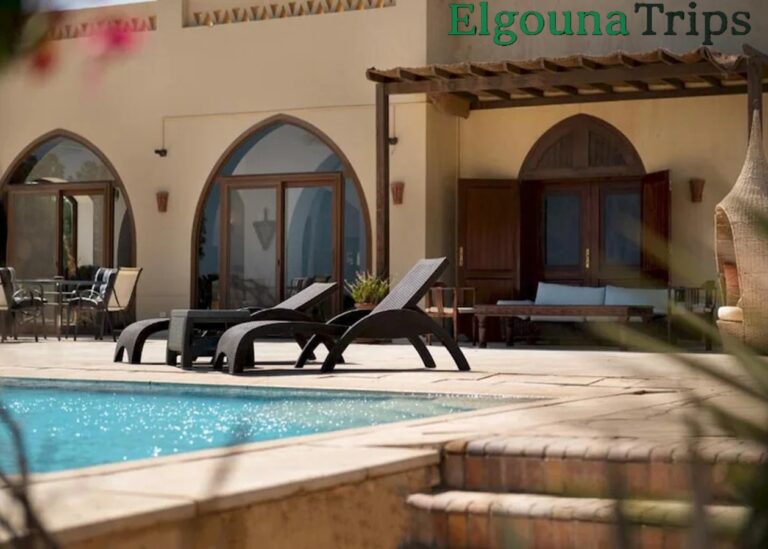 Spa & Trips from VESTA Downtown Residence El Gouna relaxing resort pool and sun loungers